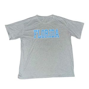 Medium light grey shirt with Light blue Florida logo (never worn)